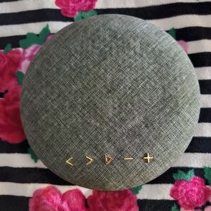 Sleek Gray Wireless Speaker with Gold Accents